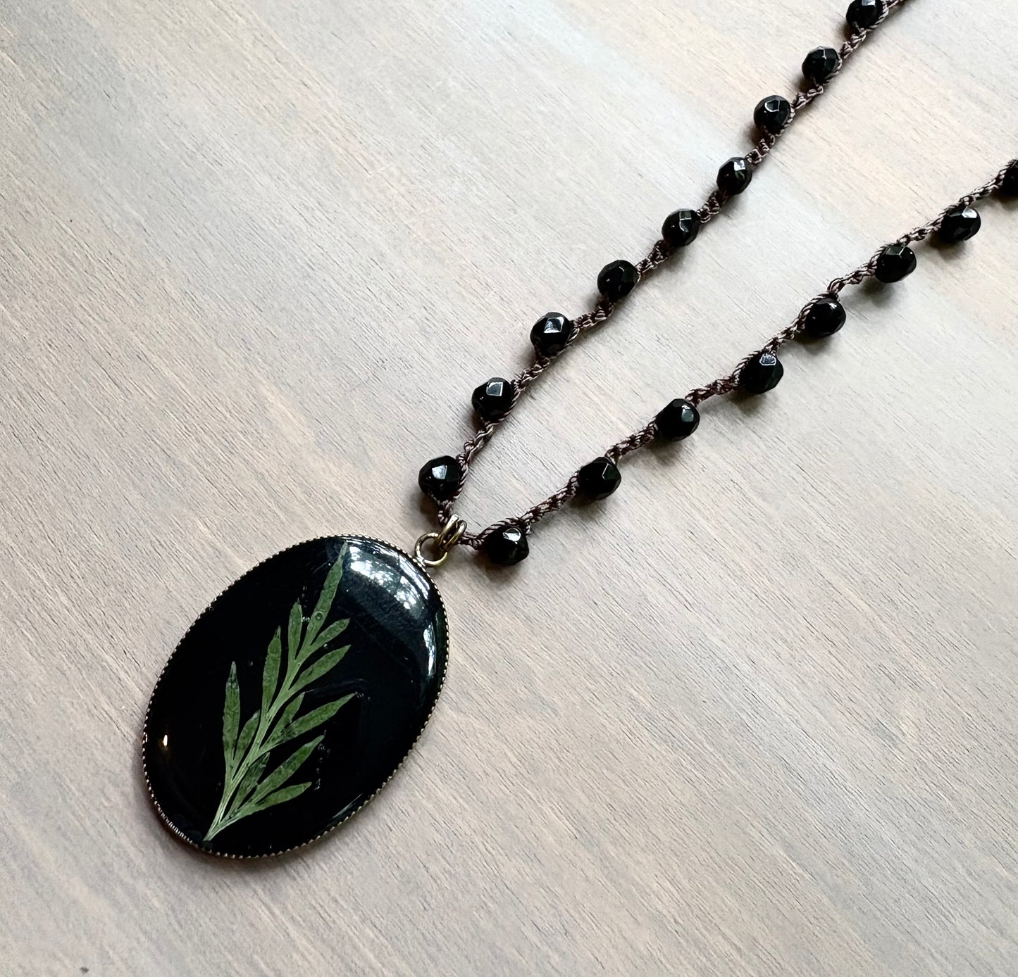 Long Botanical Pendant on Black Crystal, Version 4
