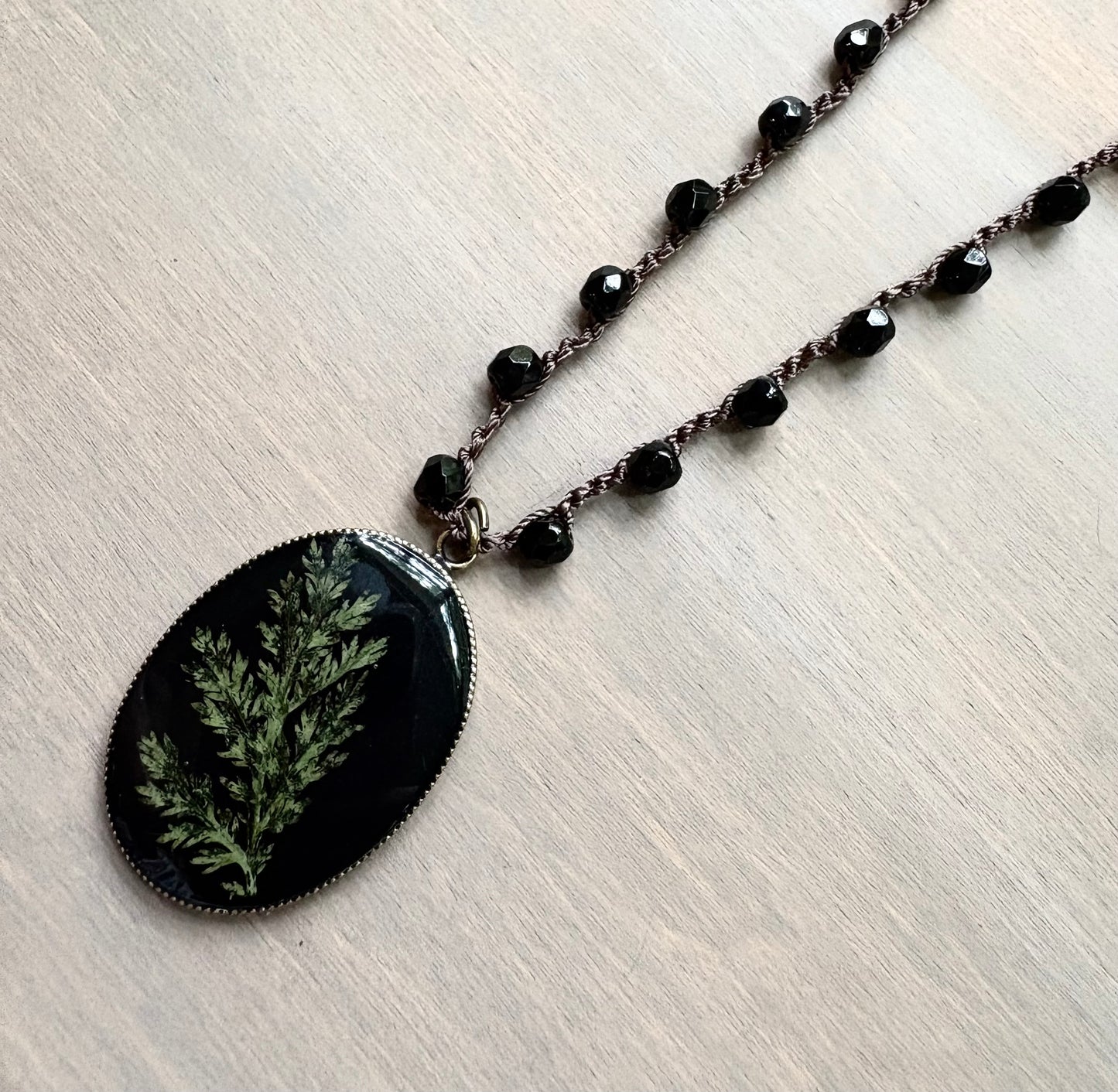 Long Botanical Pendant on Black Crystal, Version 3