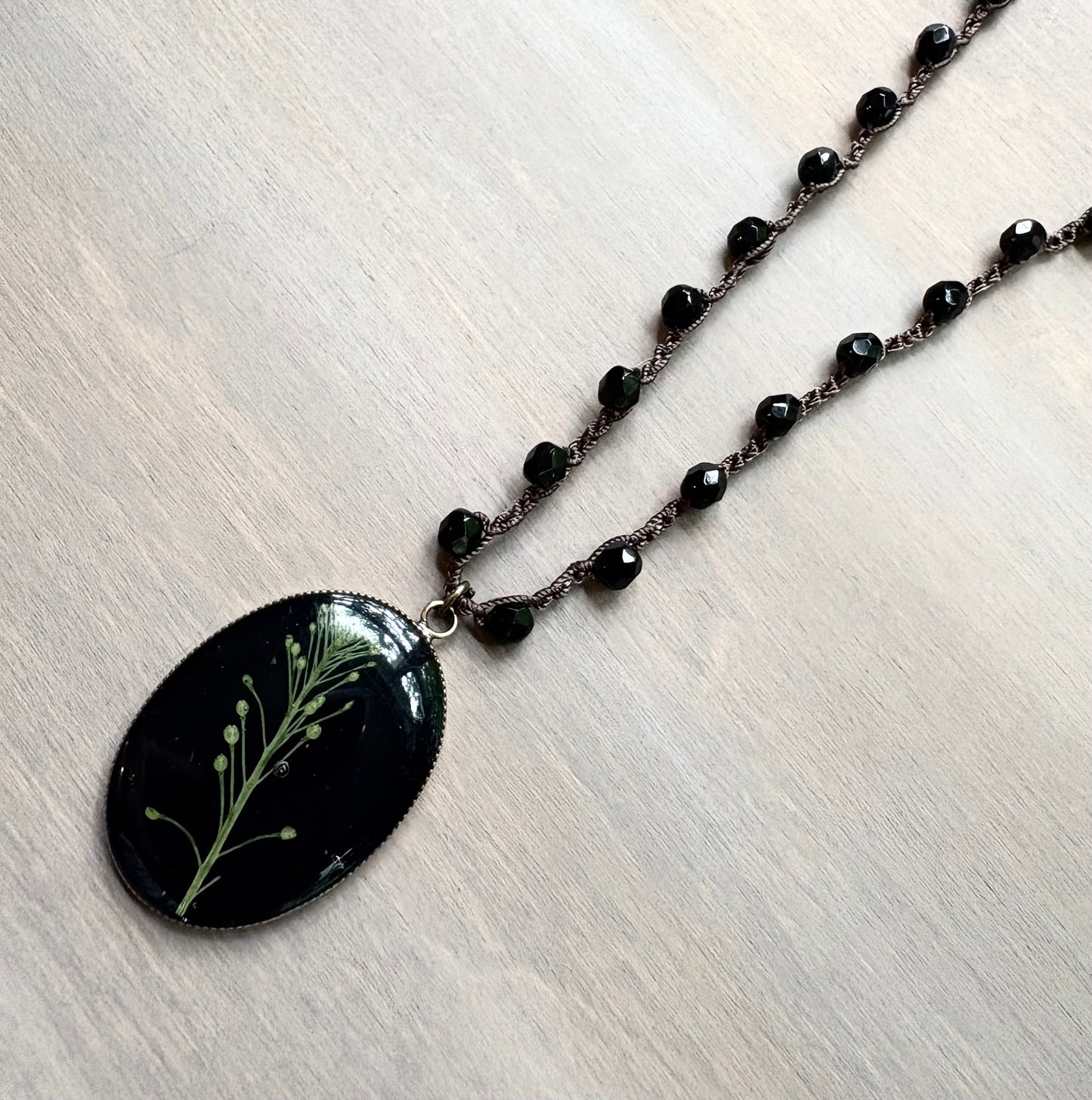 Long Botanical Pendant on Black Crystal, Version 2