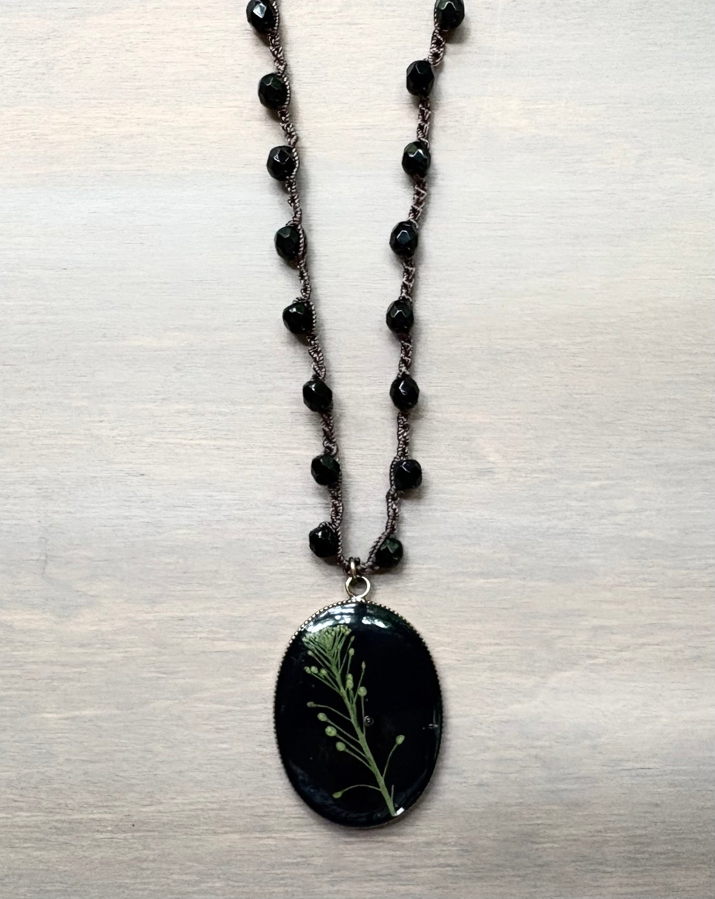 Long Botanical Pendant on Black Crystal, Version 2