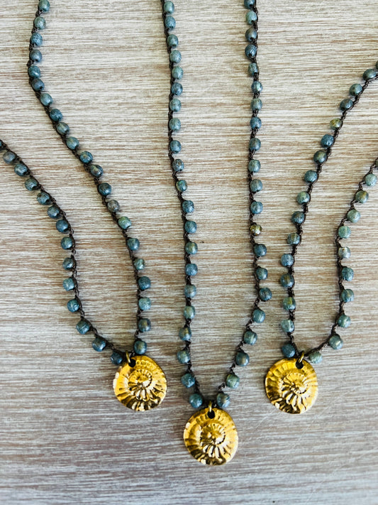 Golden Fossil Charm And Crocheted Denim Czech Crystal Strand