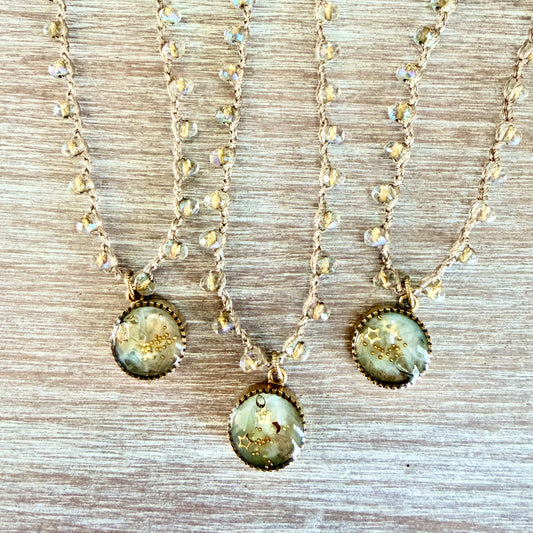 Three handmade necklaces with crystals and stars
