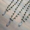 Necklace with pendant on a wooden surface