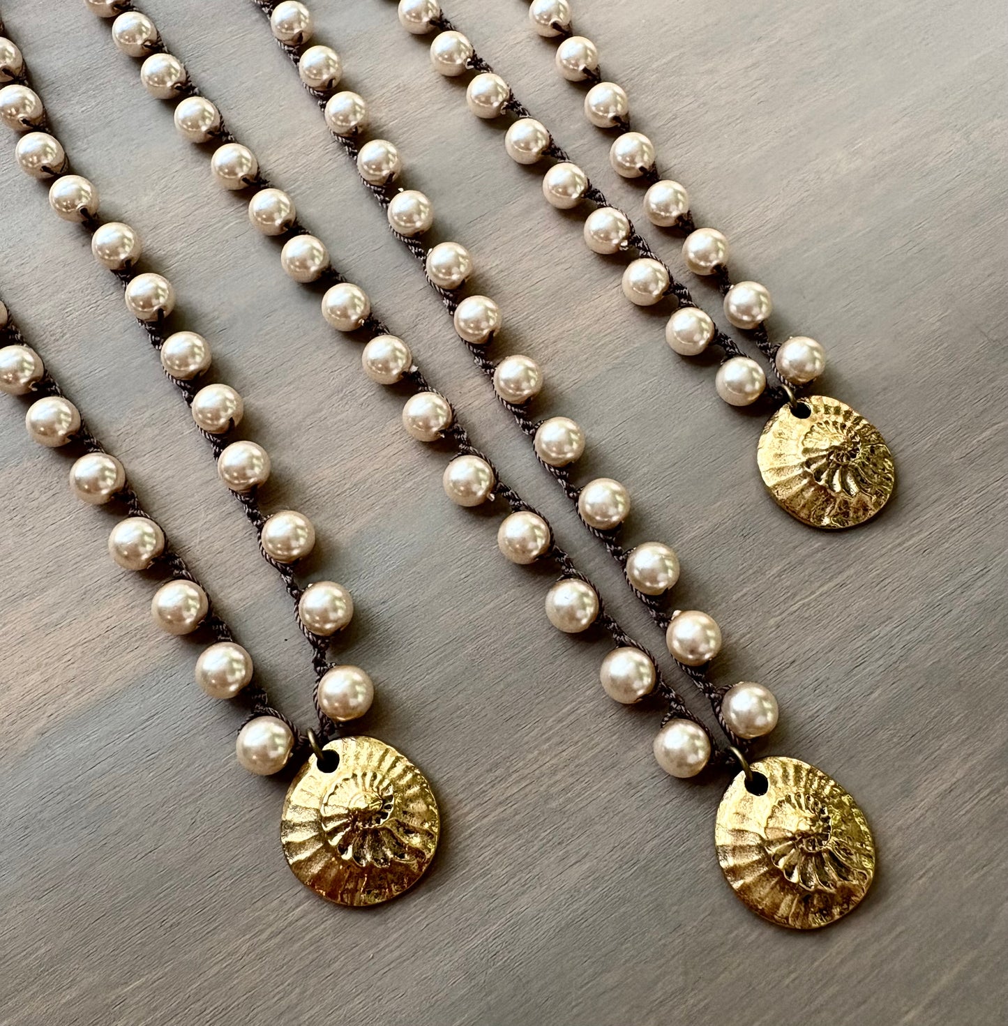 Golden Fossil on Glass Pearls