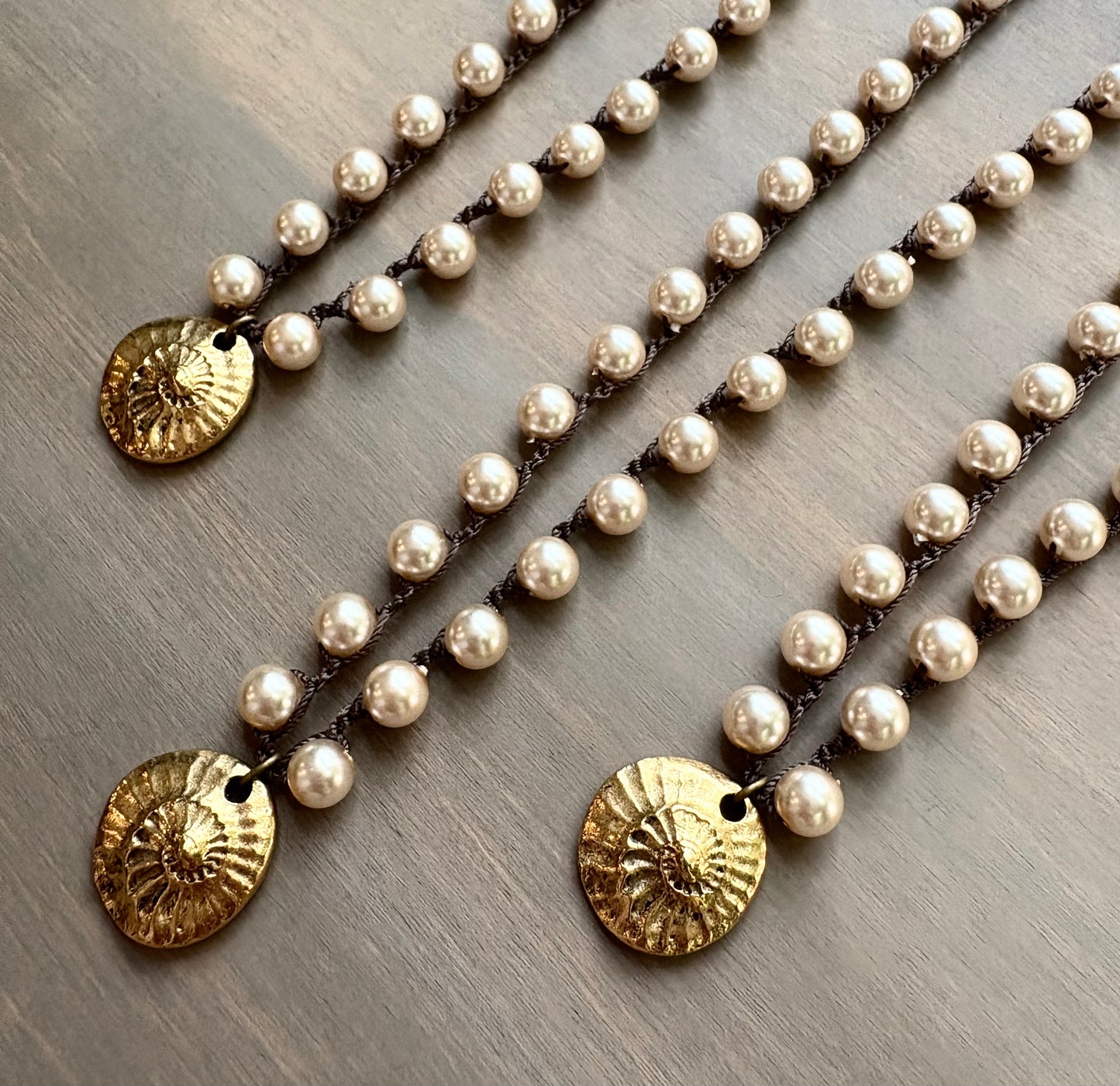 Golden Fossil on Glass Pearls