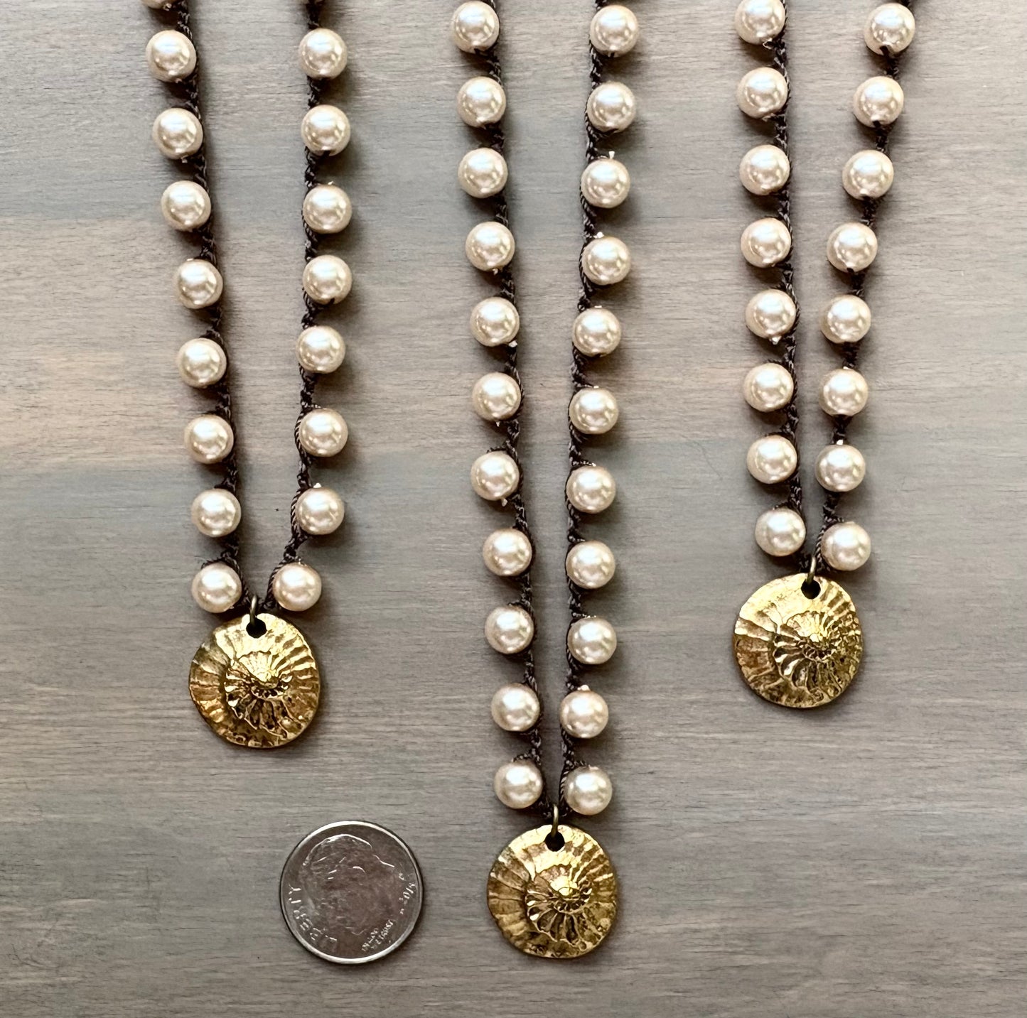 Golden Fossil on Glass Pearls
