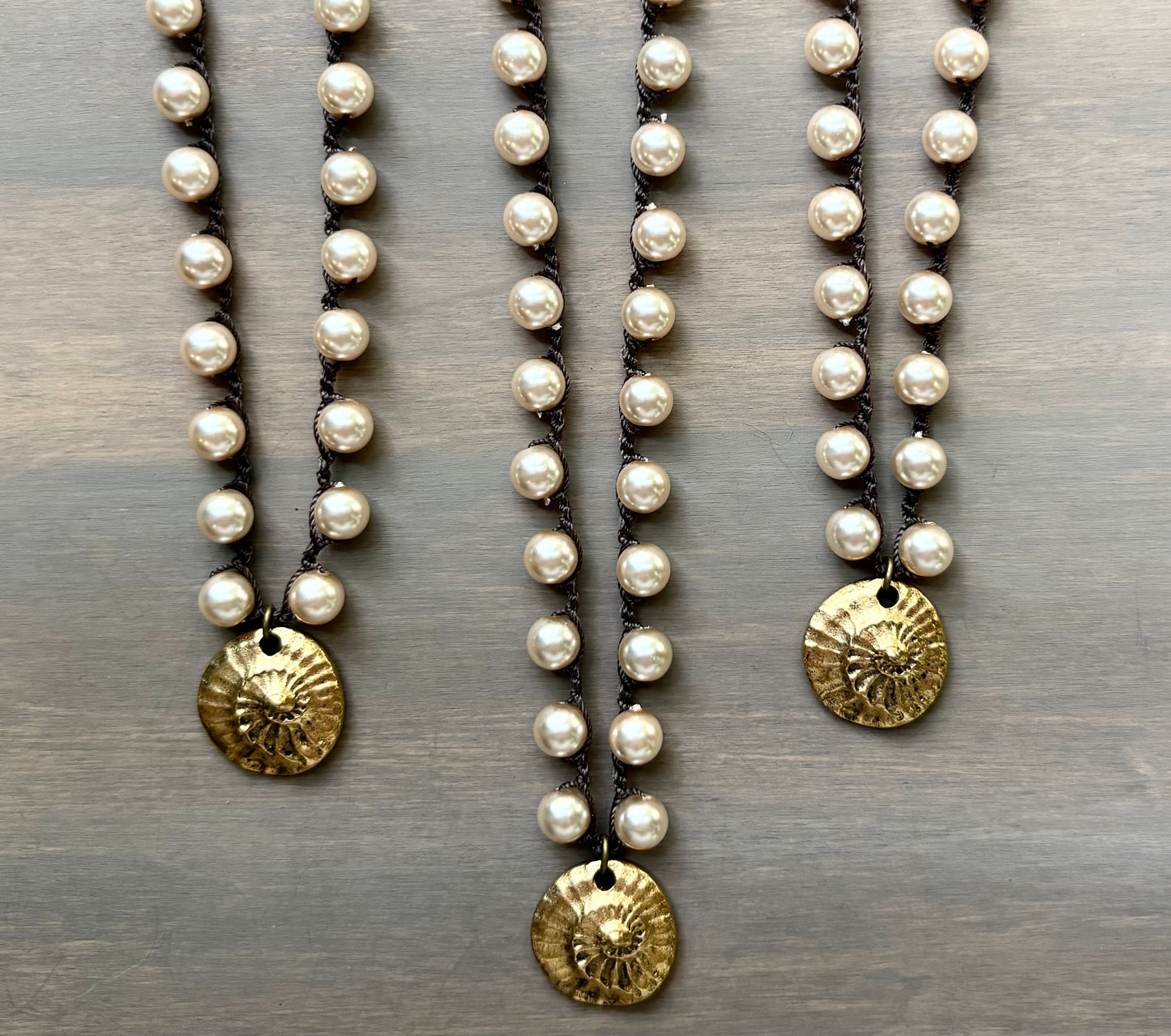 Golden Fossil on Glass Pearls