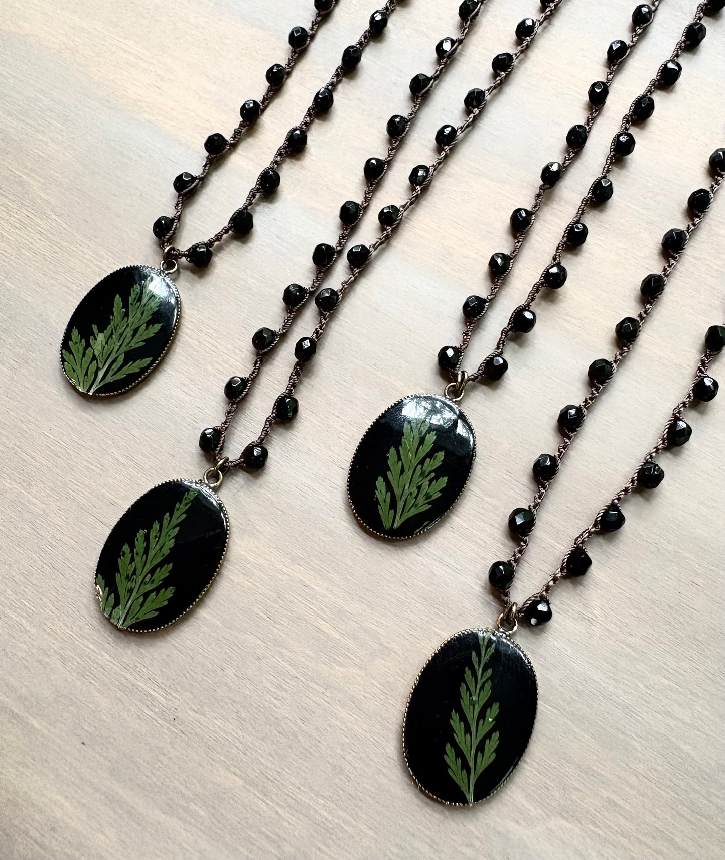 Juniper Botanical Pendant on Black Crystal