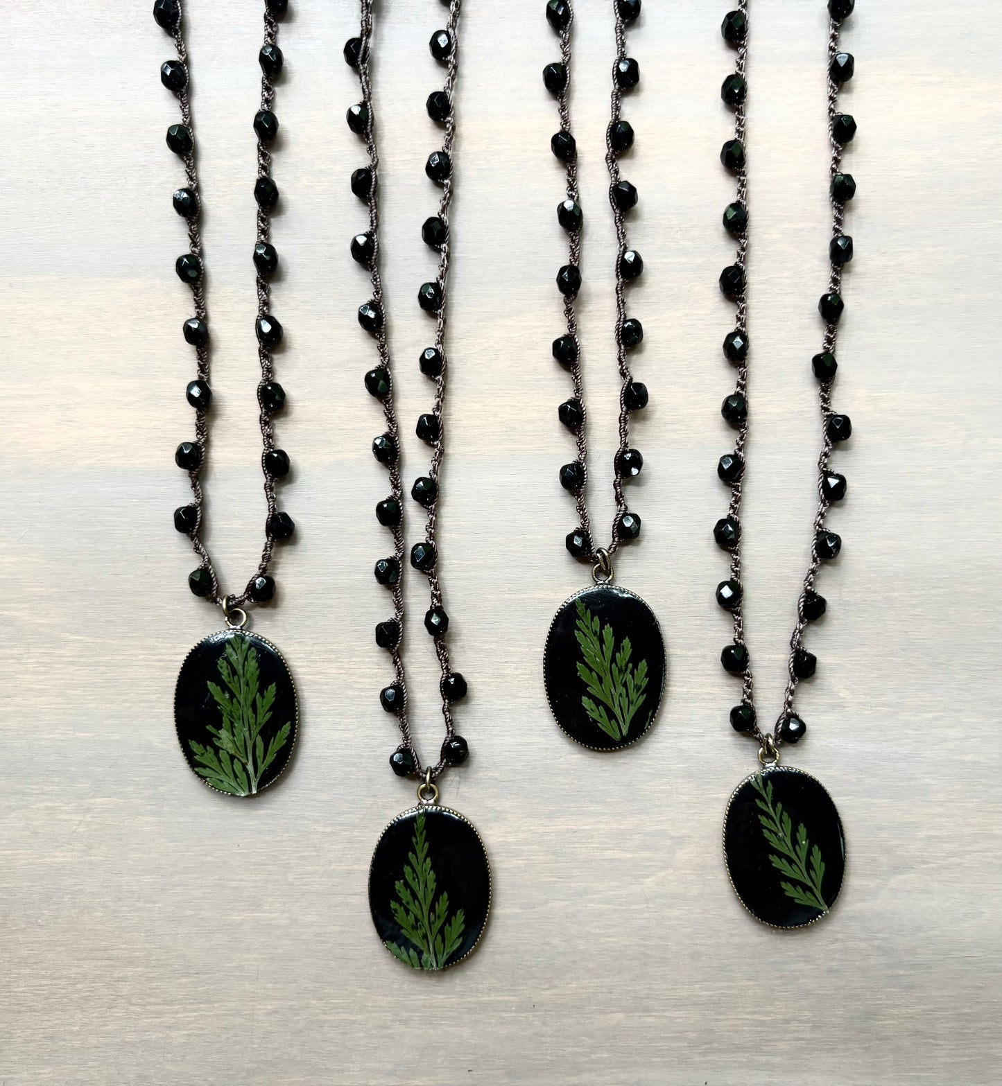 Juniper Botanical Pendant on Black Crystal